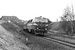 DSB MZ 1426 (type II) photographed in Fredericia - heading for Vejle. 15. January 1978.  The MZ class (type I and II) was purchased from 1967 to 1970 in a number of 26. Only a few of these engines remain in service by DSB - most are now sold to other companies. MZ 1426 was put in service in 1970. Withdrawn from service in 2000 and in 2005 sold to a compagny in USA. Built by NOHAB and Frichs. Dieselelectric. Co'Co'. 2270 kW - 3300 hp. Max speed 143 km/h - 89 mph. Length 20 800 mm. Weight 116,5 metric tonnes.